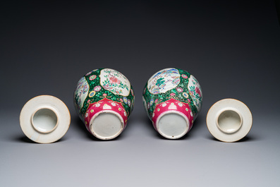A pair of Chinese famille rose black-ground jars and covers with mountainous landscape design, Yongzheng