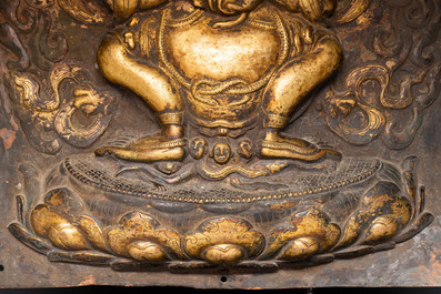 A Tibetan gilt copper 'Mahakala' plaque, 19th C.