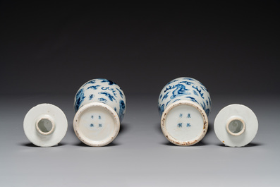 A pair of Chinese blue and white covered vases and three jars, 19th C.