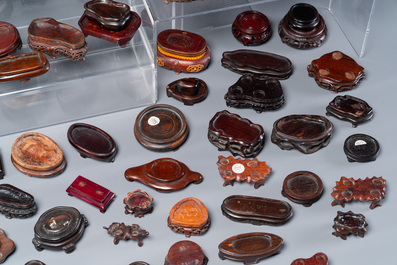 An extensive collection of 137 varied Chinese small wooden stands, 19/20th C.