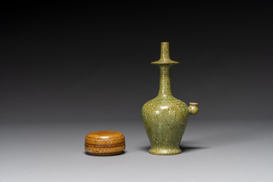 A Chinese yellow-glazed marbled covered box and a green-glazed marbled ewer, Tang/Song