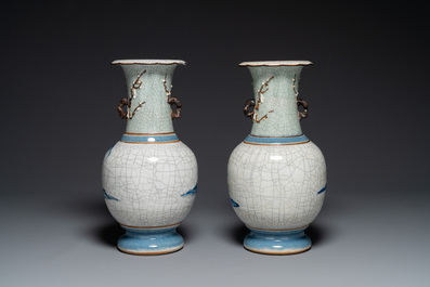 A pair of Chinese blue and white Nanking crackle-glazed 'Taoist' vases, 19th C.