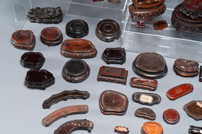 An extensive collection of 137 varied Chinese small wooden stands, 19/20th C.