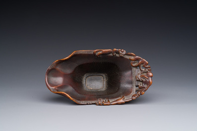 A Chinese carved rhinoceros horn 'libation cup' with chilong design, 17/18th C.