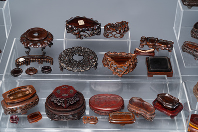 An extensive collection of 137 varied Chinese small wooden stands, 19/20th C.