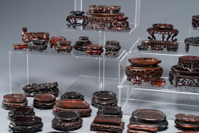 An extensive collection of 137 varied Chinese small wooden stands, 19/20th C.
