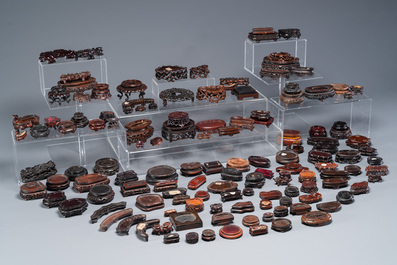 An extensive collection of 137 varied Chinese small wooden stands, 19/20th C.