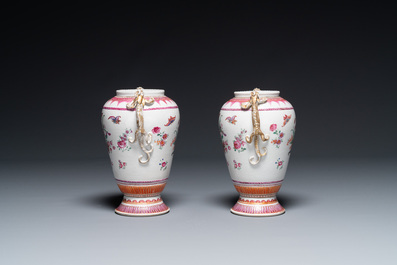 A pair of Chinese famille rose 'cornucopia' vases with chilong handles, Qianlong