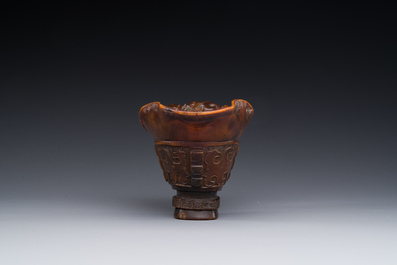 A Chinese carved rhinoceros horn 'libation cup' with chilong design, 17/18th C.