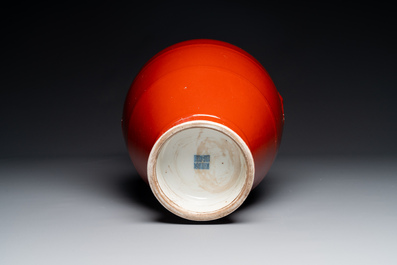A Chinese monochrome red-glazed 'hu' vase, Qianlong mark, 19th C.