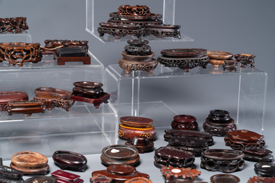 An extensive collection of 137 varied Chinese small wooden stands, 19/20th C.
