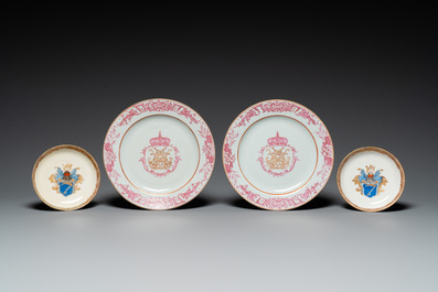 A pair of monogrammed Chinese puce-enamelled plates and a pair of armorial cups and saucers, Yongzheng/Qianlong