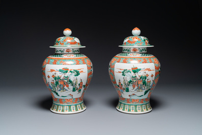 A pair of Chinese famille verte 'Wen Wang Fang Xian 文王訪賢' vases and covers, 19th C.