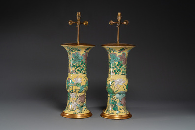 A pair of Chinese verte biscuit 'gu' vases with gilt bronze lamp mounts, 19th C.