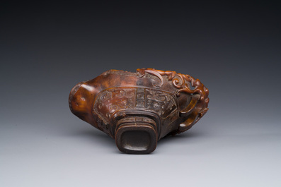 A Chinese carved rhinoceros horn 'libation cup' with chilong design, 17/18th C.