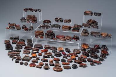 An extensive collection of 137 varied Chinese small wooden stands, 19/20th C.