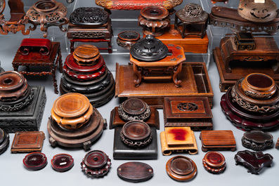 A large collection of 76 varied Chinese wooden stands and covers and 2 boxes, 19/20th C.