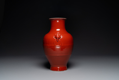 A Chinese monochrome red-glazed 'hu' vase, Qianlong mark, 19th C.