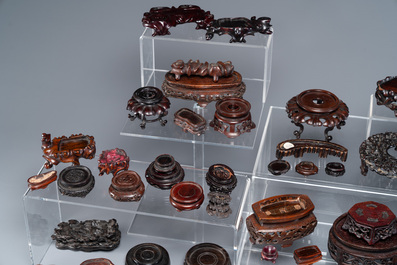 An extensive collection of 137 varied Chinese small wooden stands, 19/20th C.