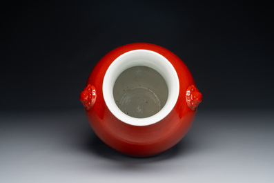 A Chinese monochrome red-glazed 'hu' vase, Qianlong mark, 19th C.