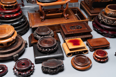 A large collection of 76 varied Chinese wooden stands and covers and 2 boxes, 19/20th C.