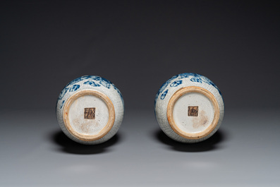 A pair of Chinese blue and white Nanking crackle-glazed 'Taoist' vases, 19th C.