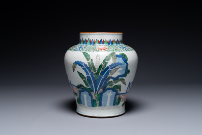 A Chinese wucai 'qilin' baluster vase, 19th C.