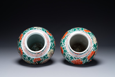 A pair of Chinese wucai 'phoenix and peony scroll' vases, Transitional period