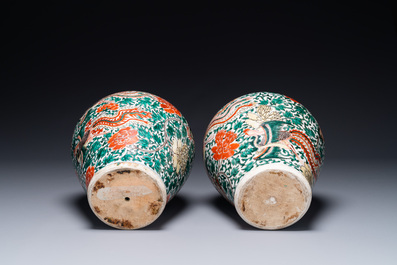 A pair of Chinese wucai 'phoenix and peony scroll' vases, Transitional period