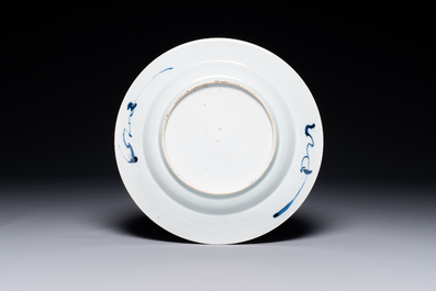 A Chinese blue and white plate with a punishment scene, Yongzheng/Qianlong