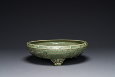 A large Chinese Longquan celadon 'trigrams' censer on wooden stand, Ming