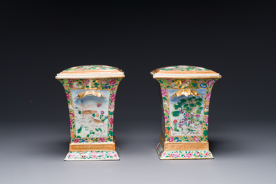 A pair of Chinese Canton famille rose bough pots and covers, 19th C.