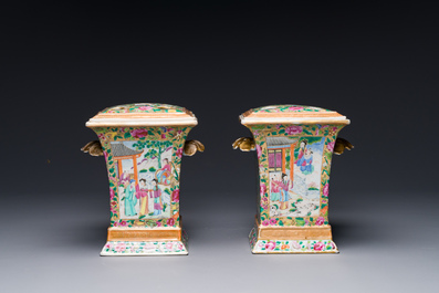 A pair of Chinese Canton famille rose bough pots and covers, 19th C.