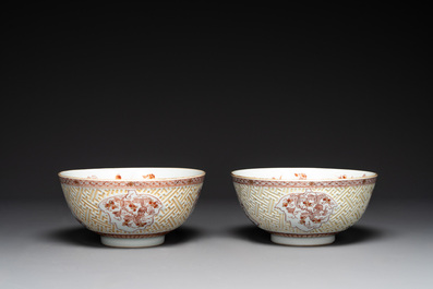 A pair of Chinese iron-red-decorated and gilt bowls with relief design, Kangxi