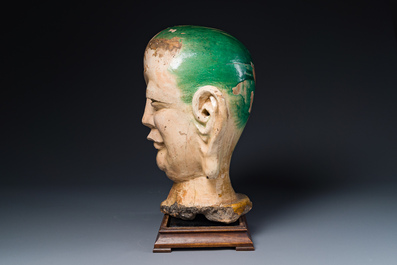 An imposing Chinese sancai glazed stoneware head of a monk, Yuan/Ming