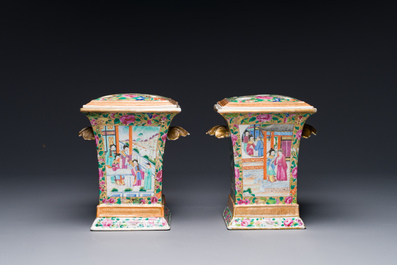 A pair of Chinese Canton famille rose bough pots and covers, 19th C.