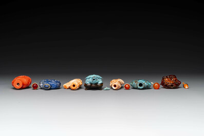 Seven varied Chinese snuff bottles of precious stone, red coral, glass and amber, 19th C.