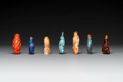 Seven varied Chinese snuff bottles of precious stone, red coral, glass and amber, 19th C.