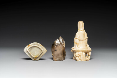 A Chinese soapstone and a crystal figures of Guanyin and a jade 'chilong' plaque, 19th C.