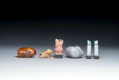 A group of Chinese carvings of lapis lazuli, pink quartz and other precious stones, with several stands, 19/20th C.