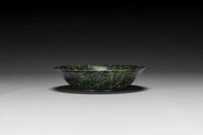 A Chinese dark green jade bowl, 18th C.