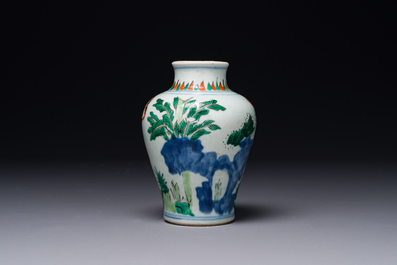 A small Chinese wucai jar with figures in a landscape, Transitional period