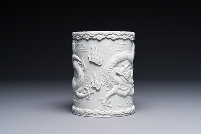 A Chinese monochrome white-glazed biscuit brush pot, signed Wang Bingrong 王炳榮, 19/20th C.