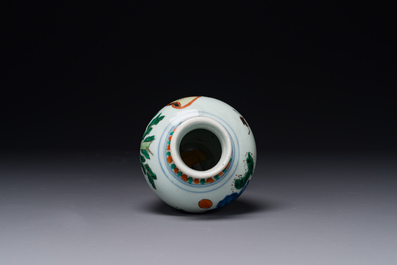 A small Chinese wucai jar with figures in a landscape, Transitional period