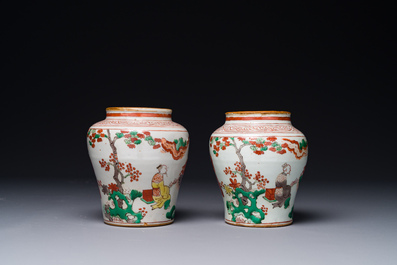 A pair of small Chinese wucai jars with figures in a landscape, Transitional period