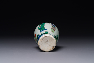 A small Chinese wucai jar with figures in a landscape, Transitional period