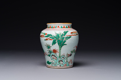 A small Chinese wucai jar with figures in a landscape, Transitional period