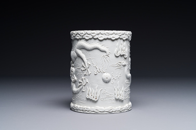 A Chinese monochrome white-glazed biscuit brush pot, signed Wang Bingrong 王炳榮, 19/20th C.