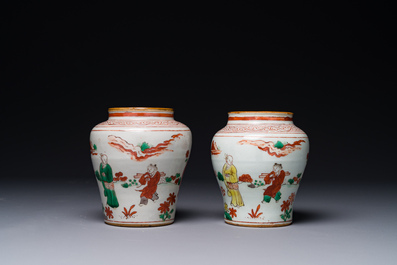 A pair of small Chinese wucai jars with figures in a landscape, Transitional period