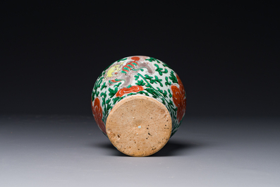 A small Chinese wucai 'Buddhist lion and peony scroll' jar, Transitional period